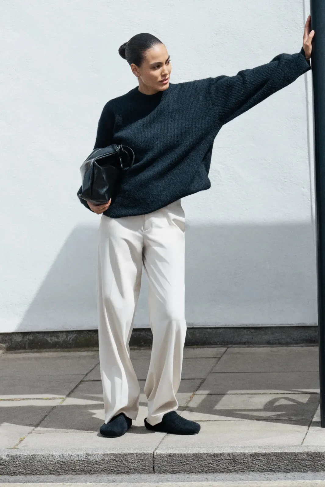 Woman wearing Round-Toe Clog Mules as she steps out